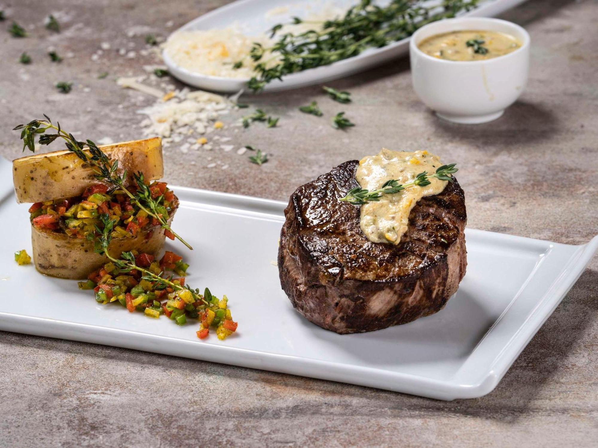 فندق وشقق موفنبيك الرياض المظهر الخارجي الصورة A steak prepared with a butter sauce